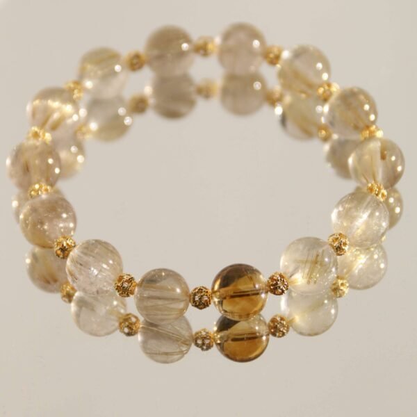 Amber Golden Rhyme: Handmade Bracelet with Yellow Hair Crystal and Yellow Pagoda Crystal as the Main Bead
